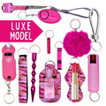 Collection of pink keychains and self-defense items with 'LUXE MODEL' text on a white background.
