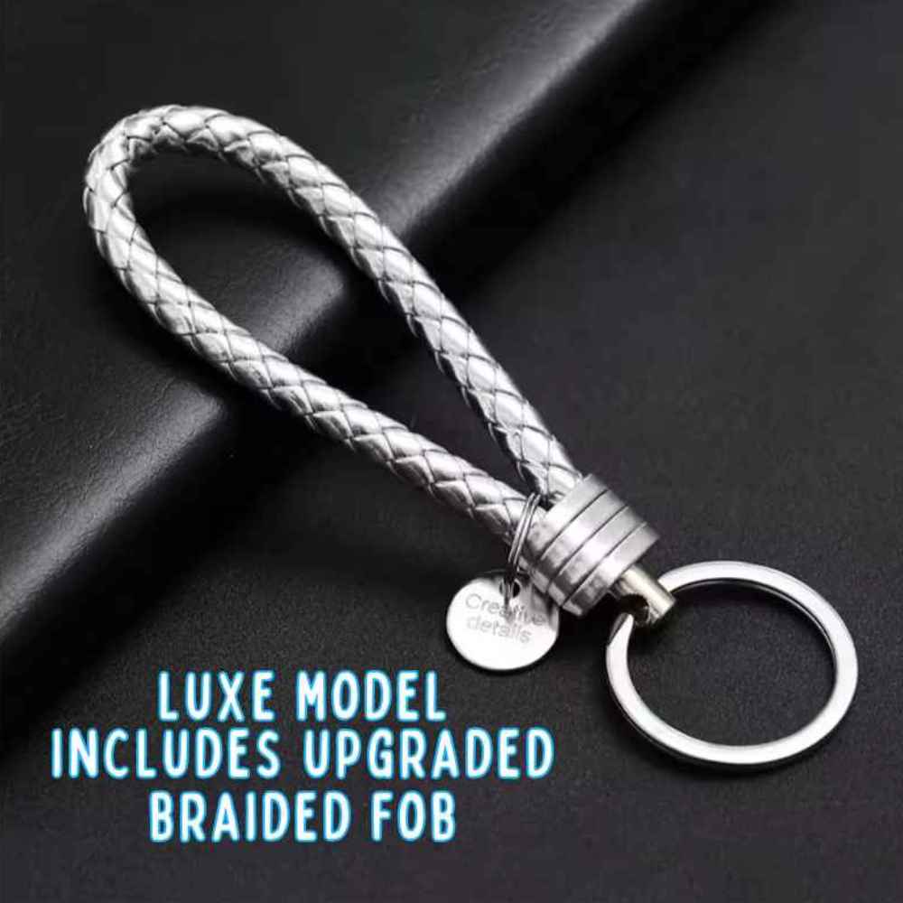 Silver braided keychain on a dark background with text indicating an upgraded feature.