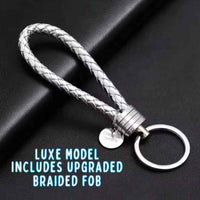 Silver braided keychain on a dark background with text indicating an upgraded feature.
