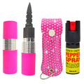 A self-defense keychain set featuring a bright pink pepper spray canister, a matching pink-and-black personal safety stick with a pointed blade, a pink rhinestone-covered key case, and a black pepper spray bottle with a red top and yellow label.