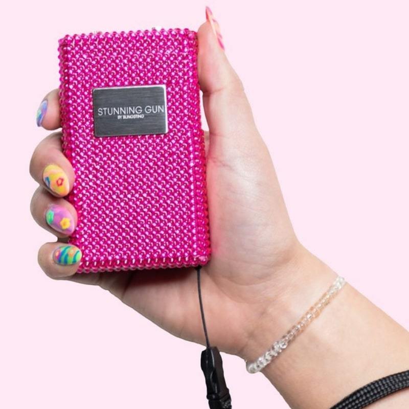 defense divas pink rhinestone bling sting stun gun bling taser in hand