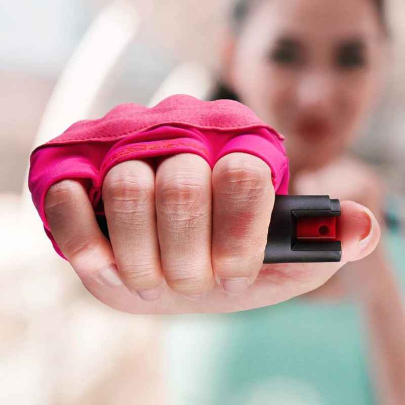 female-runner-using-instafire-pepper-spray-glove