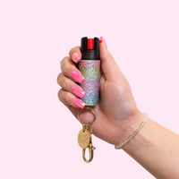 rainbow glow bling pepper spray keychain in hand
